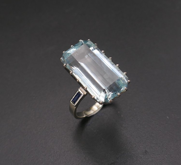 Ring Set with an Aquamarine Shouldered with Calibrated Sapphires.