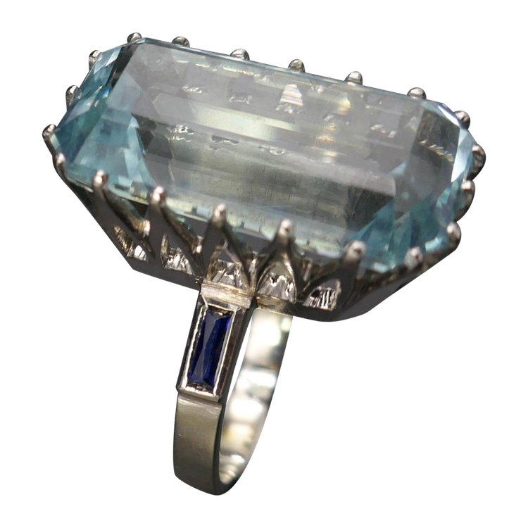 Ring Set with an Aquamarine Shouldered with Calibrated Sapphires.