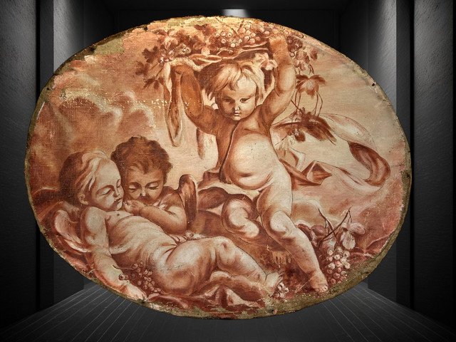 OIL ON OVAL WOOD PANELING DECORATED WITH CHERUBS CARRYING A FRUIT BOWL