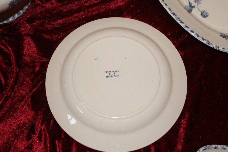 Part of a table service in earthenware decorated with shamrocks in blossom, early 20th century.