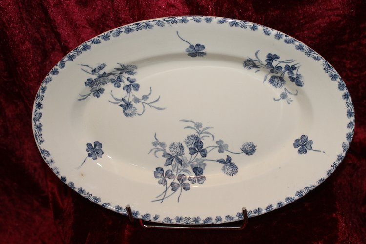 Part of a table service in earthenware decorated with shamrocks in blossom, early 20th century.