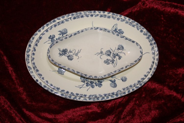 Part of a table service in earthenware decorated with shamrocks in blossom, early 20th century.