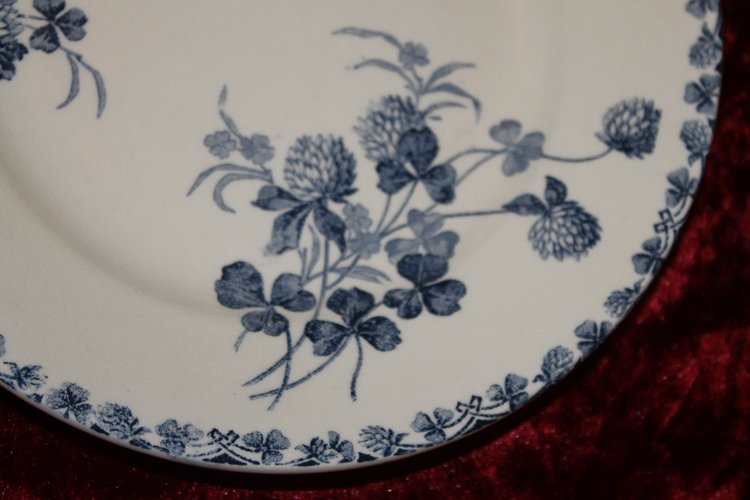 Part of a table service in earthenware decorated with shamrocks in blossom, early 20th century.