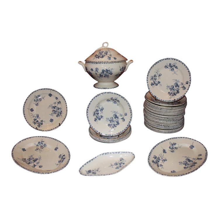 Part of a table service in earthenware decorated with shamrocks in blossom, early 20th century.