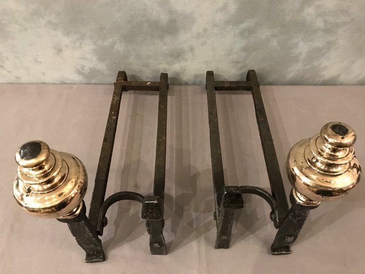 Pair of wrought iron and brass andirons from the late 17th and early 18th centuries