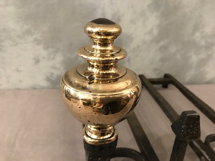 Pair of wrought iron and brass andirons from the late 17th and early 18th centuries
