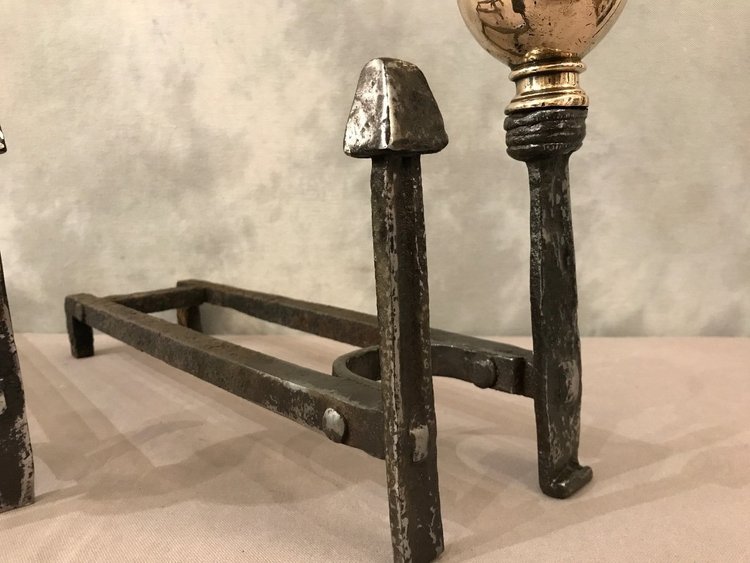 Pair of wrought iron and brass andirons from the late 17th and early 18th centuries