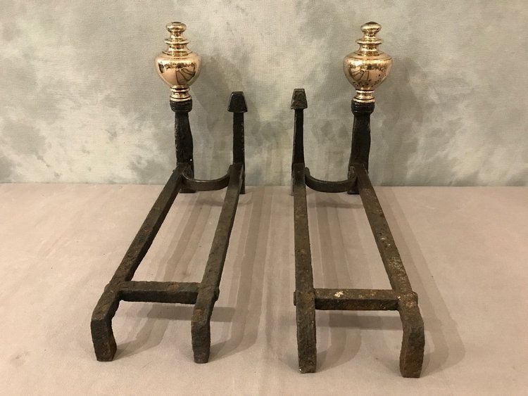 Pair of wrought iron and brass andirons from the late 17th and early 18th centuries