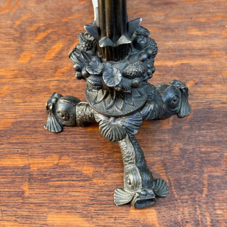 Restoration period lamp with tripod base and dolphin and cherub heads
