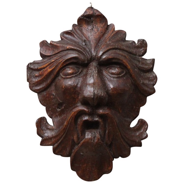 Mascaron "maschera a foglie" in legno intagliato, XVII secolo