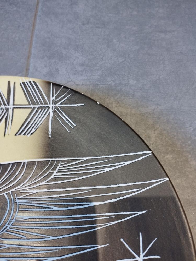 Vallauris plate with incised decoration.