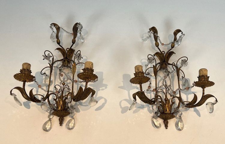 Pair of wall lights in gilded metal and crystals. French work in the style of Maison Baguès.
