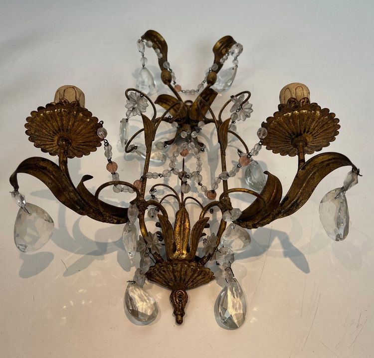 Pair of wall lights in gilded metal and crystals. French work in the style of Maison Baguès.