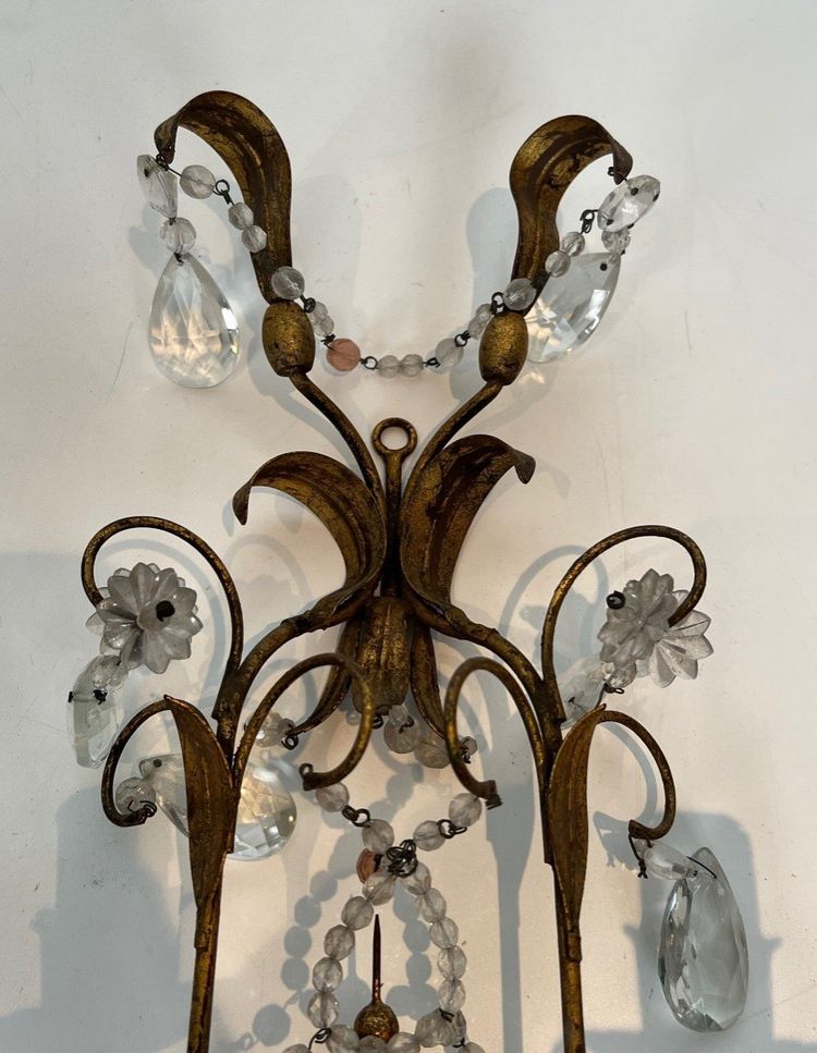 Pair of wall lights in gilded metal and crystals. French work in the style of Maison Baguès.