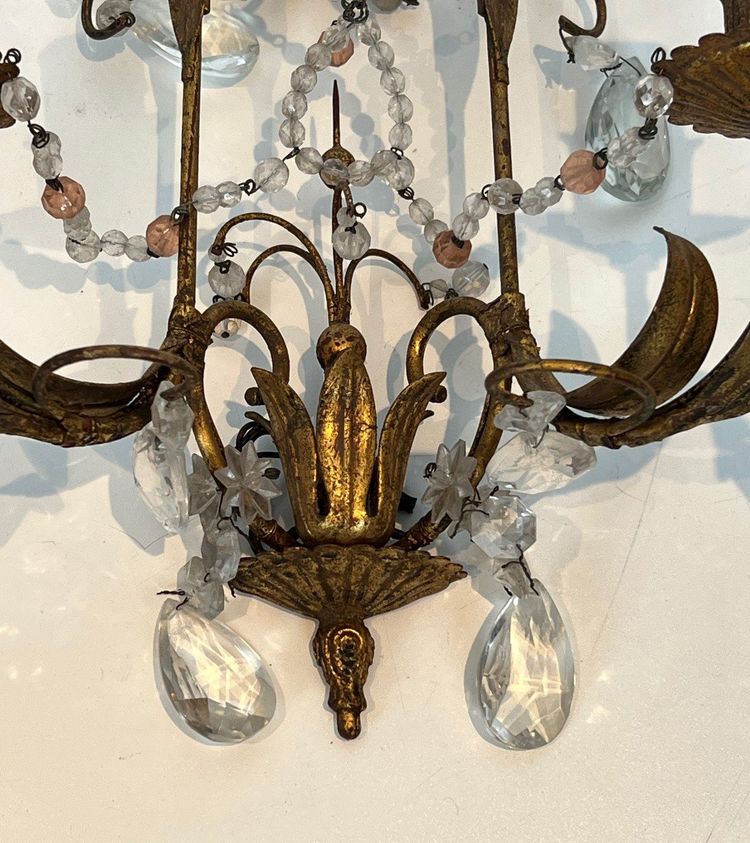 Pair of wall lights in gilded metal and crystals. French work in the style of Maison Baguès.