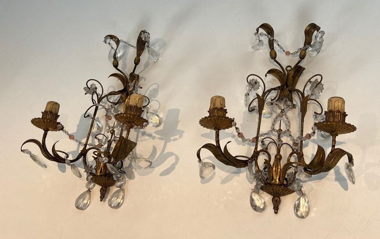 Pair of wall lights in gilded metal and crystals. French work in the style of Maison Baguès.