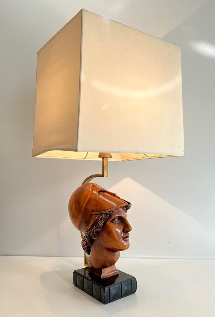 Pair of walnut lamps depicting the faces of helmeted soldiers. Italian work.