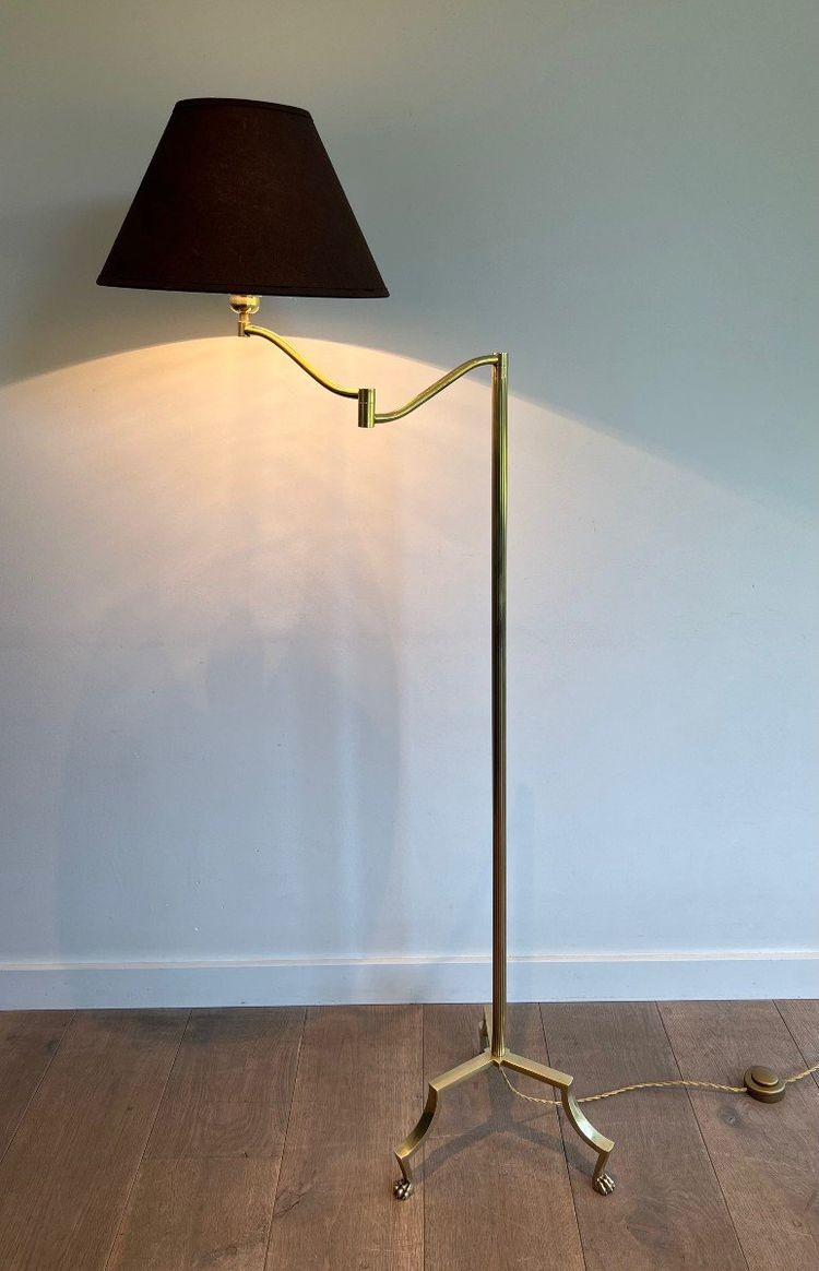 Brass reading lamp with removable, height-adjustable arm.
