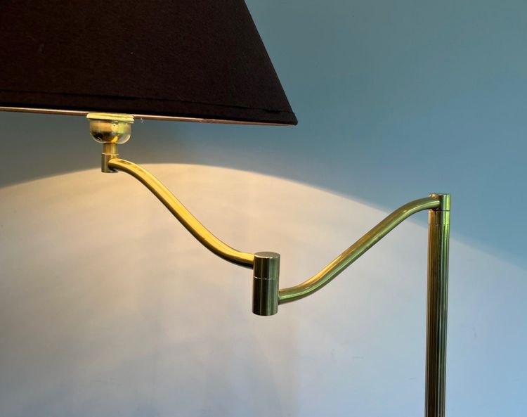 Brass reading lamp with removable, height-adjustable arm.
