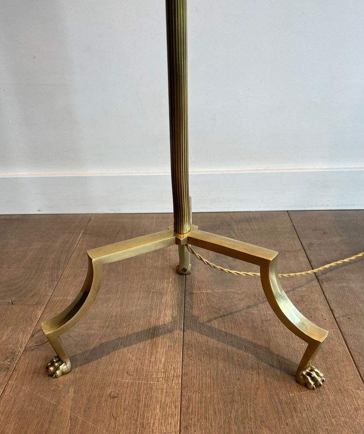 Brass reading lamp with removable, height-adjustable arm.
