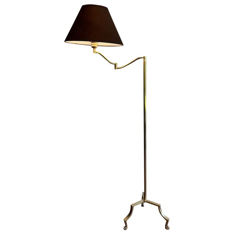 Brass reading lamp with removable, height-adjustable arm.