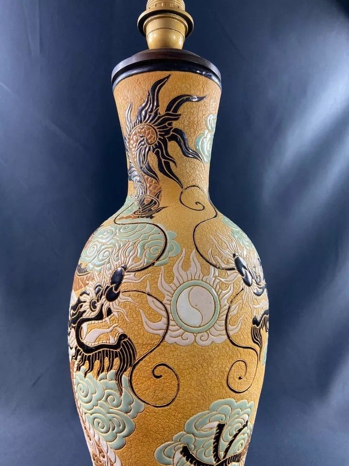 Very large BIEN HOA stoneware dragon lamp on yellow background Vietnam