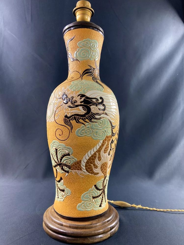 Very large BIEN HOA stoneware dragon lamp on yellow background Vietnam