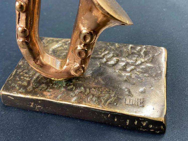 Carved saxophone subject in bronze signed Yves Lohé