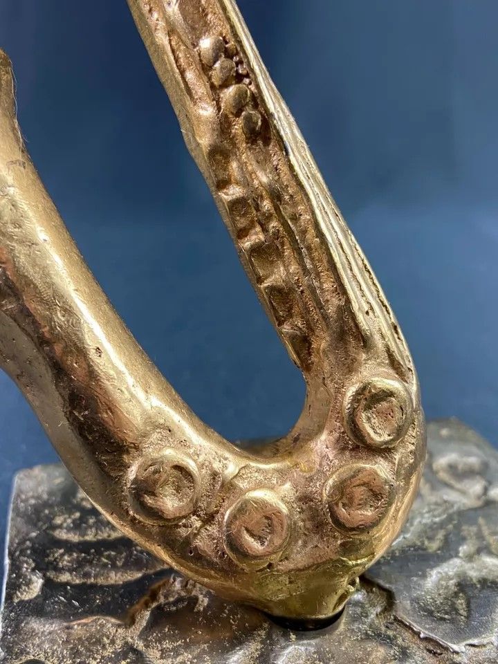 Carved saxophone subject in bronze signed Yves Lohé