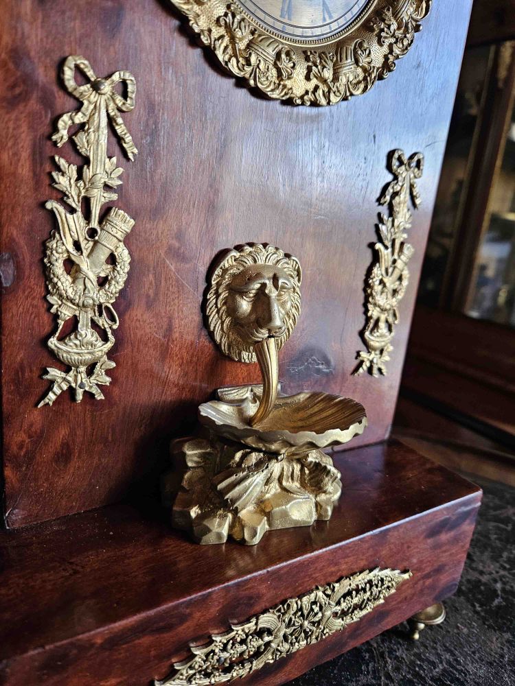 Pendulum Empire à La Fontaine Moucheted Mahogany And Gilded Bronze