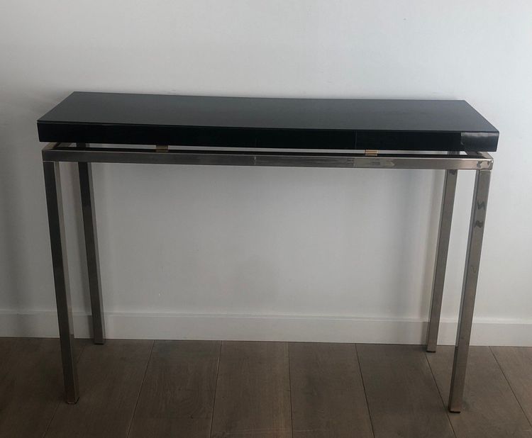 Chromed console with thick black lacquered top. French work. Circa 1970