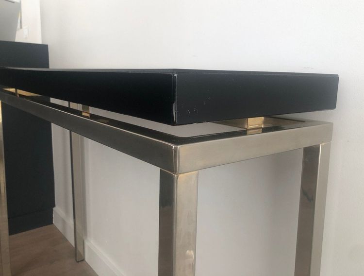 Chromed console with thick black lacquered top. French work. Circa 1970