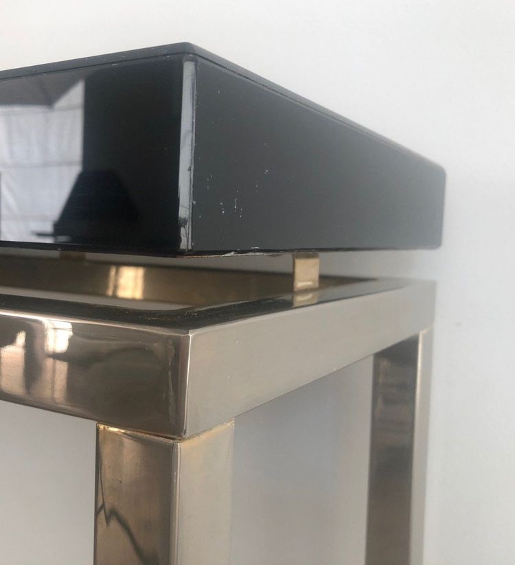 Chromed console with thick black lacquered top. French work. Circa 1970
