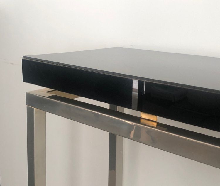 Chromed console with thick black lacquered top. French work. Circa 1970