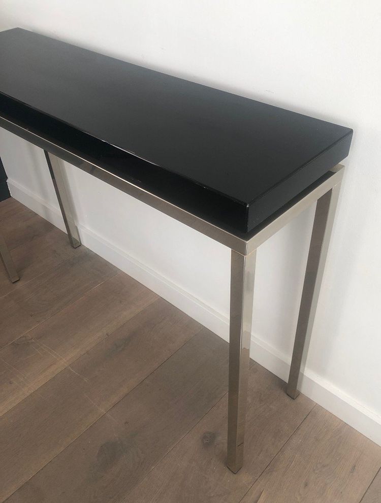 Chromed console with thick black lacquered top. French work. Circa 1970