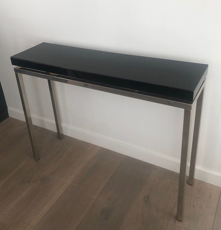 Chromed console with thick black lacquered top. French work. Circa 1970