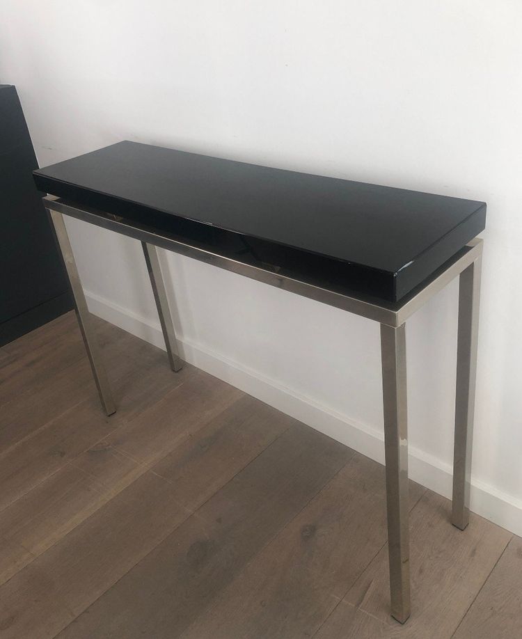 Chromed console with thick black lacquered top. French work. Circa 1970