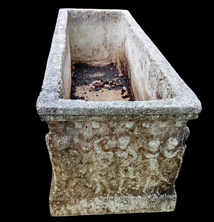Old planter with character decoration