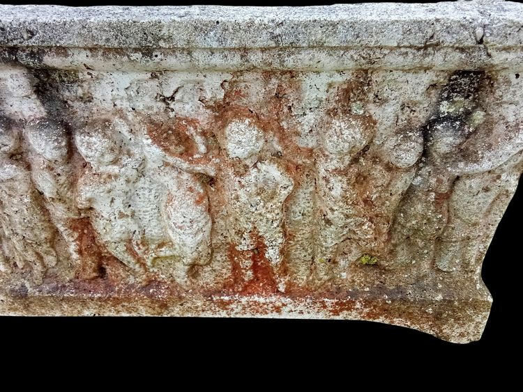 Old planter with character decoration