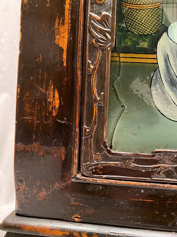 Chine début XXe, buffet bas en enfilade ouvrant à quatre portes ornées de fixés sous verre