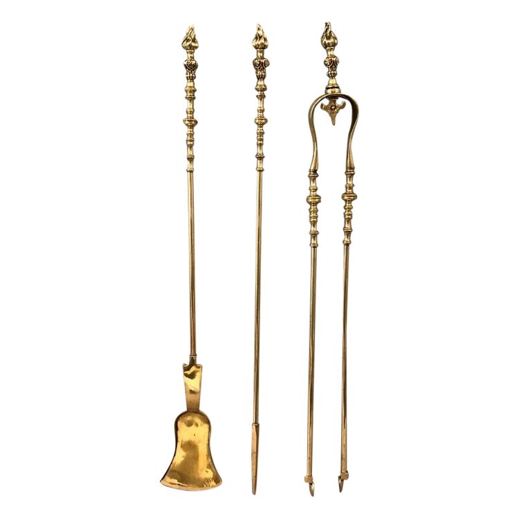 Set of three bronze and brass fireplace accessories from the 19th century.