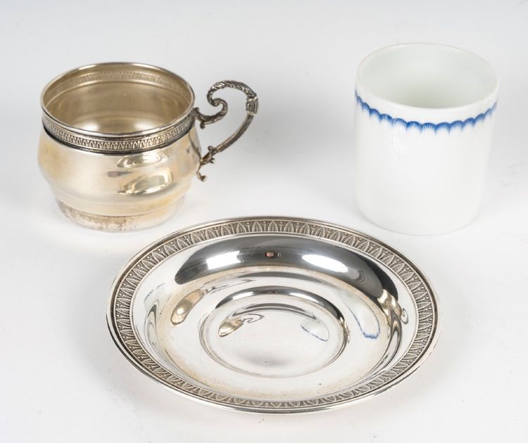 A Series Of Porcelain And Solid Silver Cups