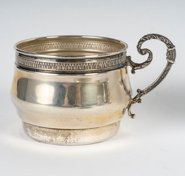 A Series Of Porcelain And Solid Silver Cups