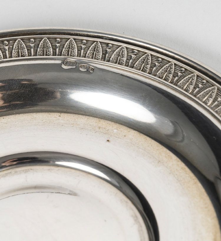 A Series Of Porcelain And Solid Silver Cups