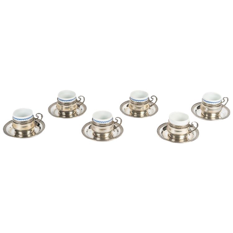 A Series Of Porcelain And Solid Silver Cups