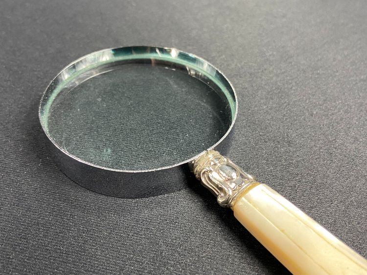 Magnifying glass with mother-of-pearl handle and silver ferrule