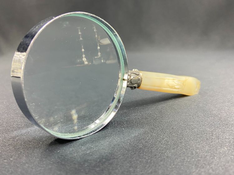 Magnifying glass with mother-of-pearl handle and silver ferrule