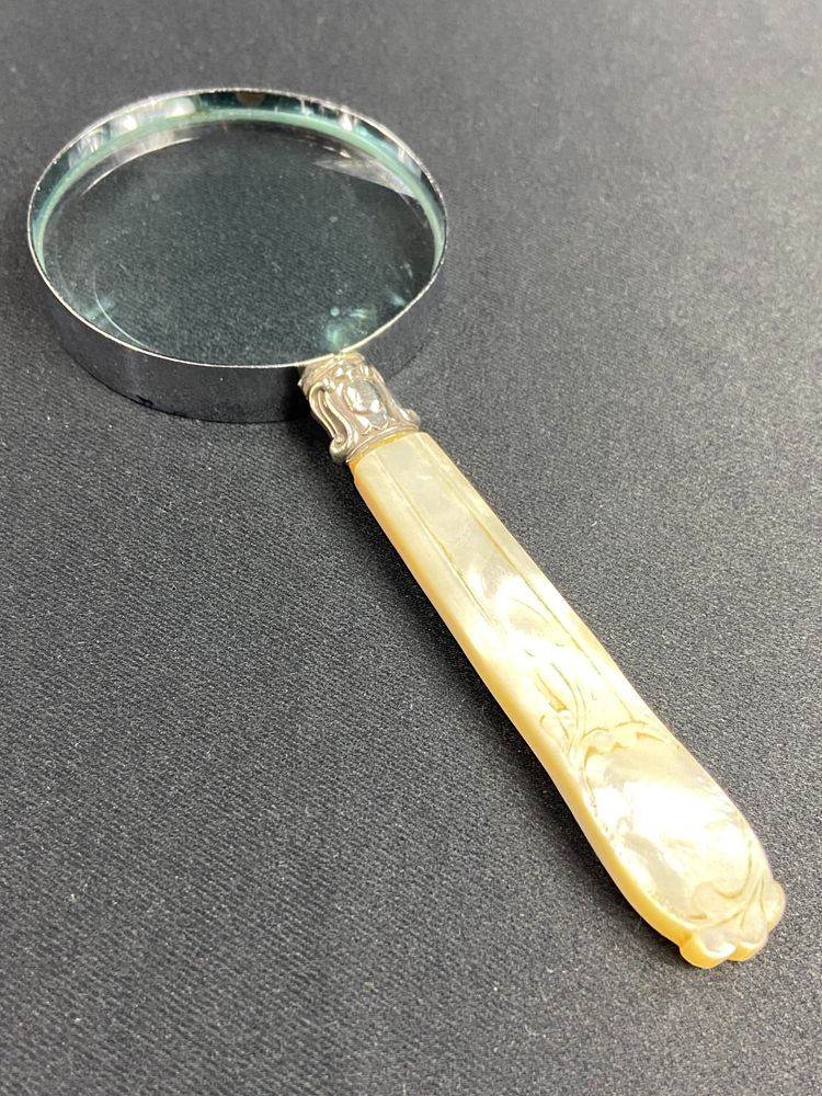 Magnifying glass with mother-of-pearl handle and silver ferrule