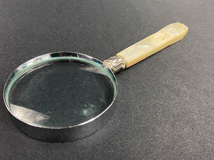 Magnifying glass with mother-of-pearl handle and silver ferrule