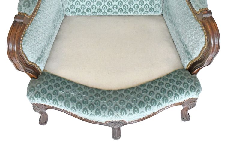 Pair of Louis XV style wingback armchairs with five legs